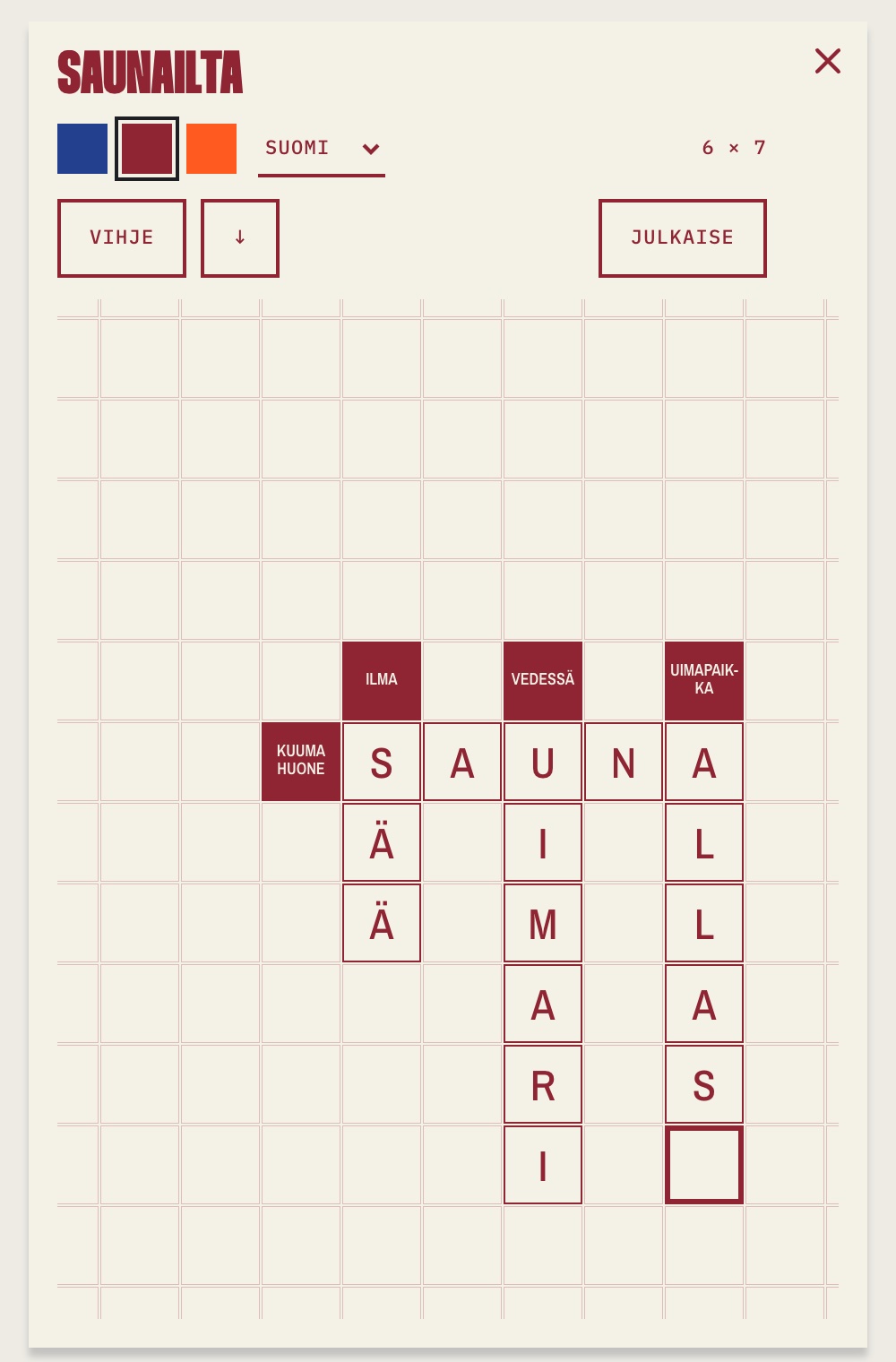 The creator on a phone: a sheet in wine red ink titled Saunailta on faint grid paper, with the words SAUNA, UIMARI, SÄÄ and ALLAS crossing, four ink clue cells, the cursor on the next empty square, and the ink, language, clue and publish controls above